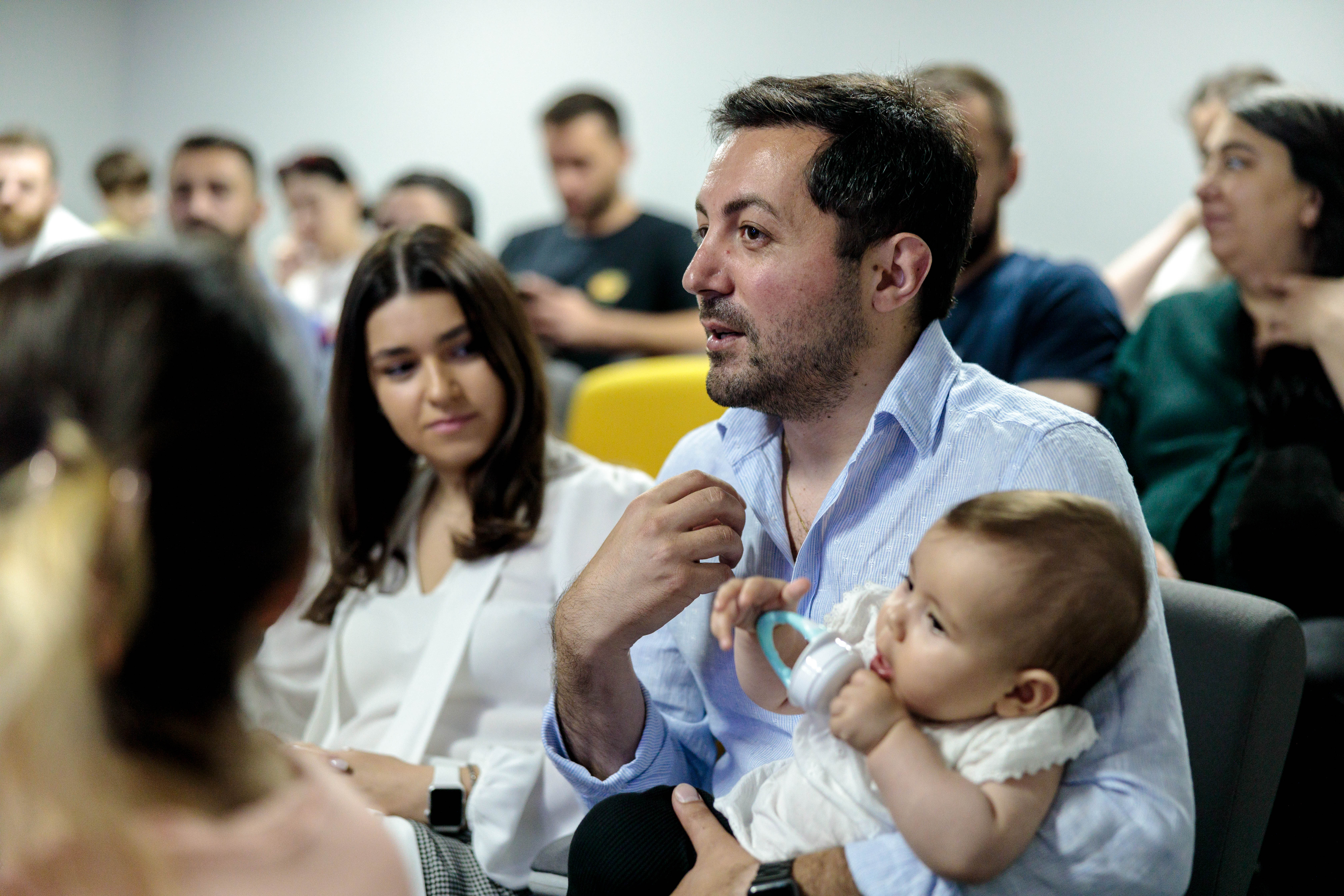 A father in Georgia participates in a Father School session that promotes sharing caregiving responsibilities and supporting women's economic empowerment. Photo: MenCare/Irakli Chelidze.